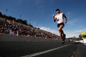 An athlete enters Panathinaikon stadium during the 30th Athens Classic Marathon race in Athens, Sun. Nov. 11 2012. More than 20,000 athletes competed at the classic marathon route and the smaller races of five and ten kilometers. (AP Photo/Kostas Tsironis)