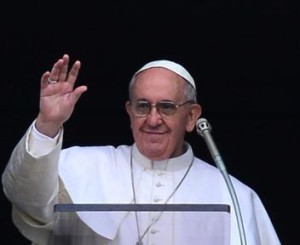 Pope Francis waves as he arrives to lead his first Angelus prayer from the window of the apartments at St Peter's square on March 17, 2013 at the Vatican.The pope's first Angelus prayer, delivered from a window high above St Peter's Square, is a chance for the first Latin American pontiff to begin to sketch out a more global vision for the role of the Roman Catholic Church.   AFP PHOTO / GIUSEPPE CACACE